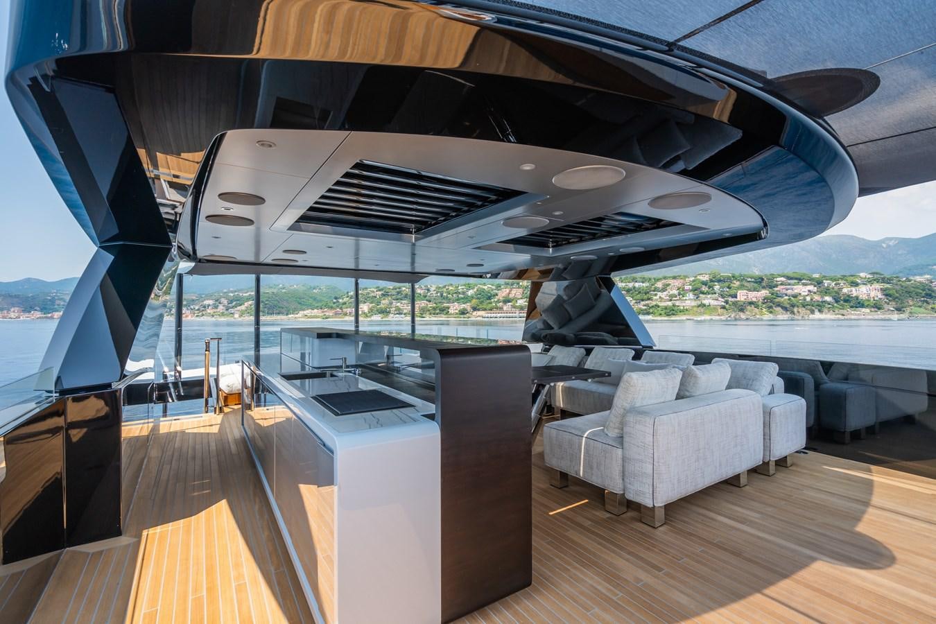 a deck with a large deck and a large pool aboard JIMMY Yacht for Sale
