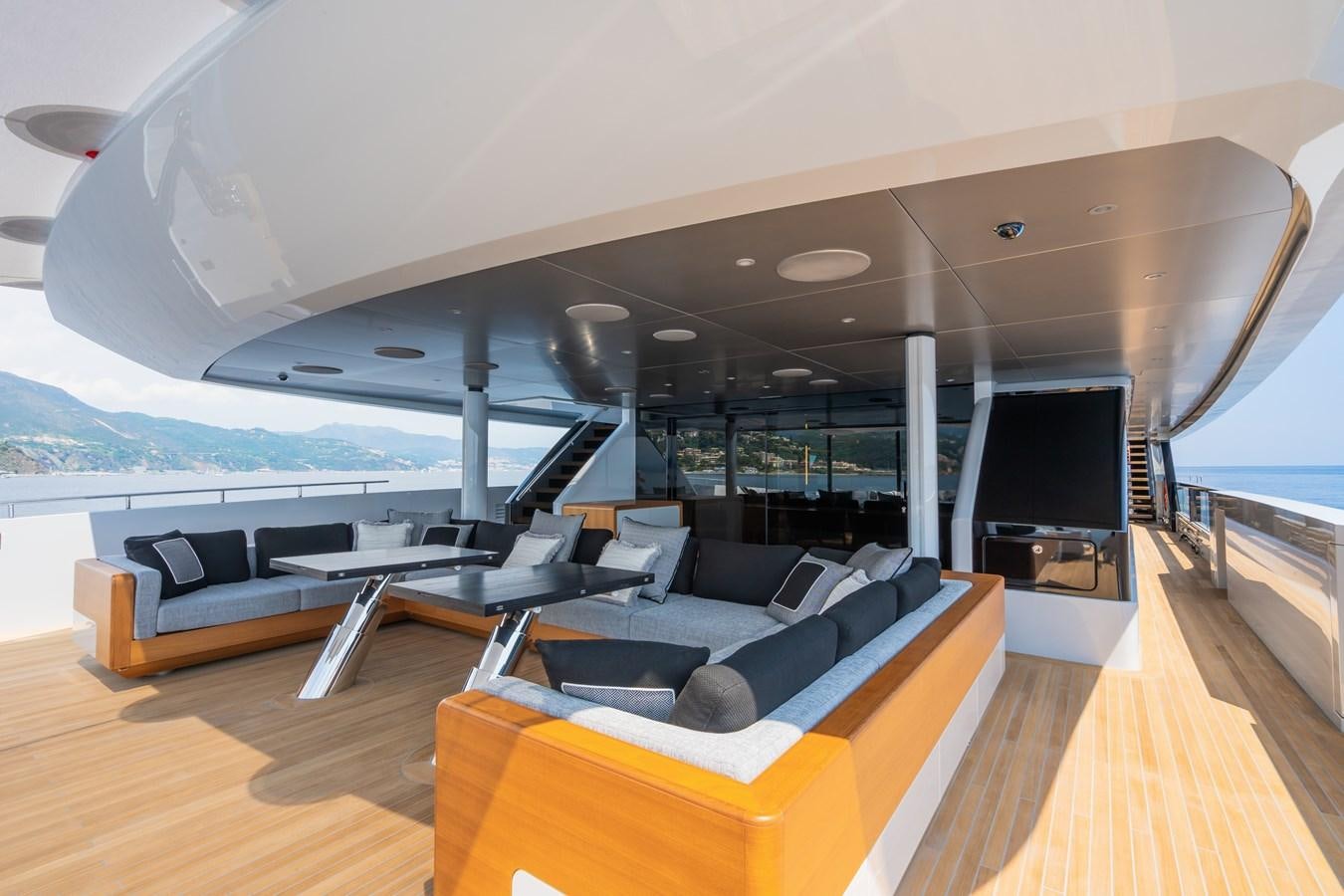 a large living room with a large tv and a large open window aboard JIMMY Yacht for Sale