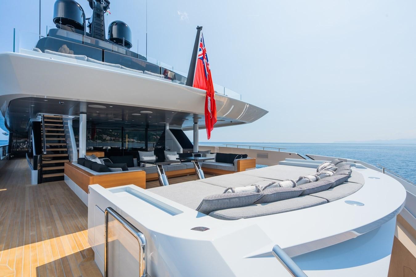 a large white boat on a deck aboard JIMMY Yacht for Sale