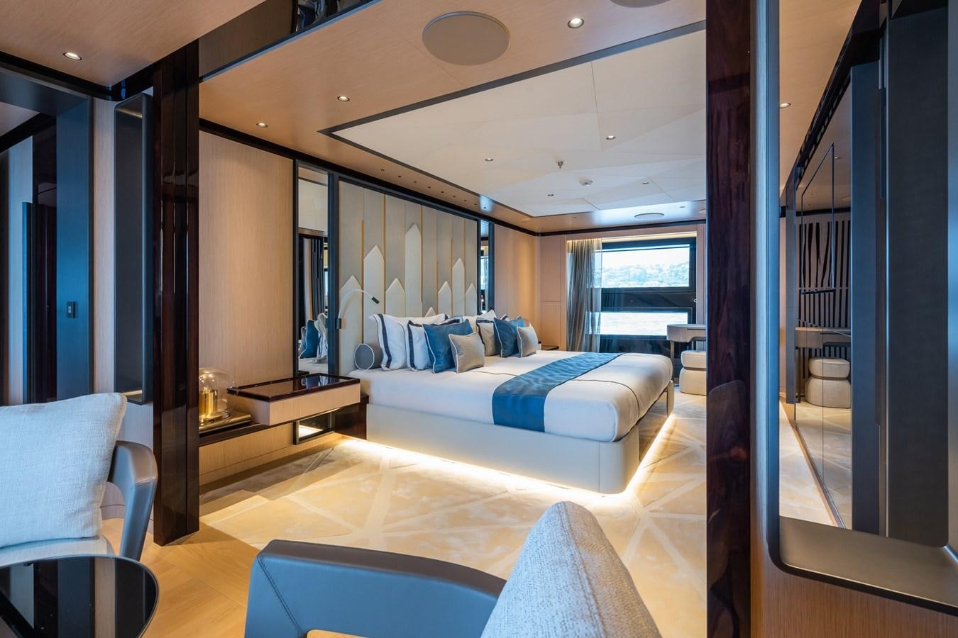 a room with a bed and a desk aboard JIMMY Yacht for Sale