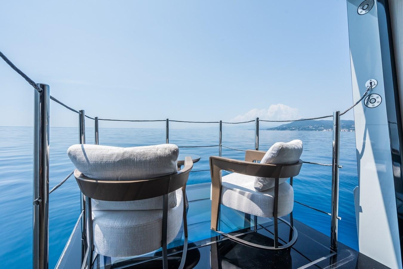 a boat with chairs on the deck aboard JIMMY Yacht for Sale