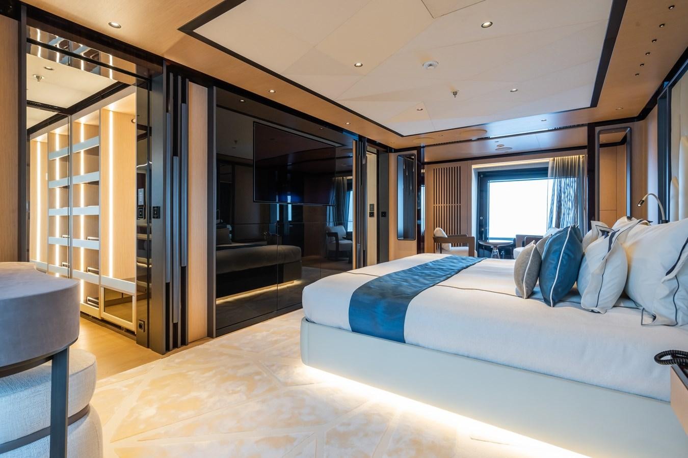 a room with a bed and a closet aboard JIMMY Yacht for Sale