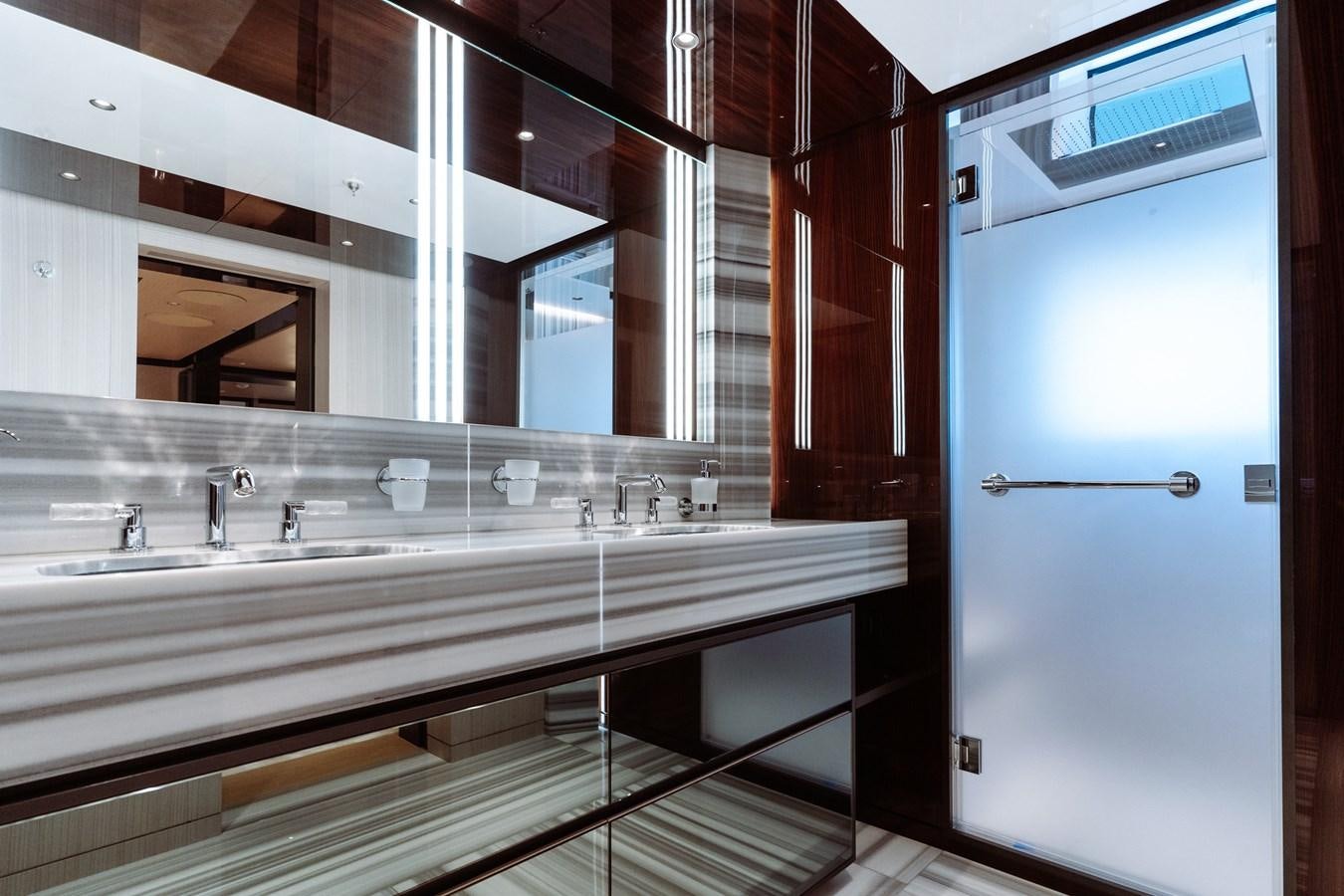 a bathroom with a large mirror aboard JIMMY Yacht for Sale