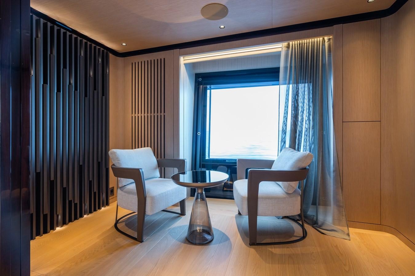 a room with a table and chairs aboard JIMMY Yacht for Sale