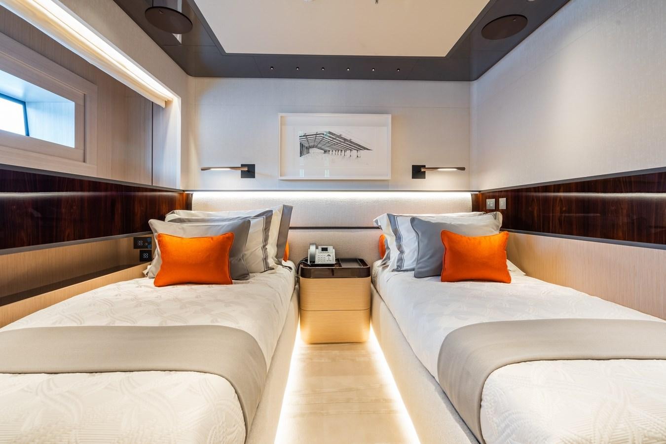 a room with beds and a window aboard JIMMY Yacht for Sale