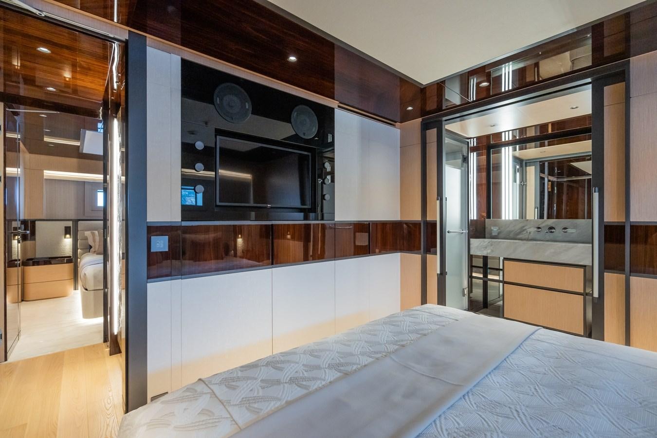 a bedroom with a large mirror aboard JIMMY Yacht for Sale