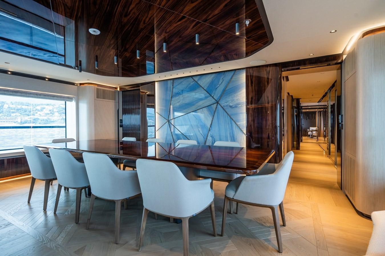 a room with a table chairs and a large window aboard JIMMY Yacht for Sale