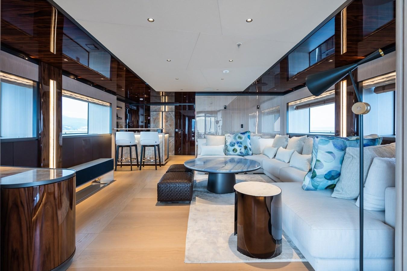 a living room with a couch and a table aboard JIMMY Yacht for Sale