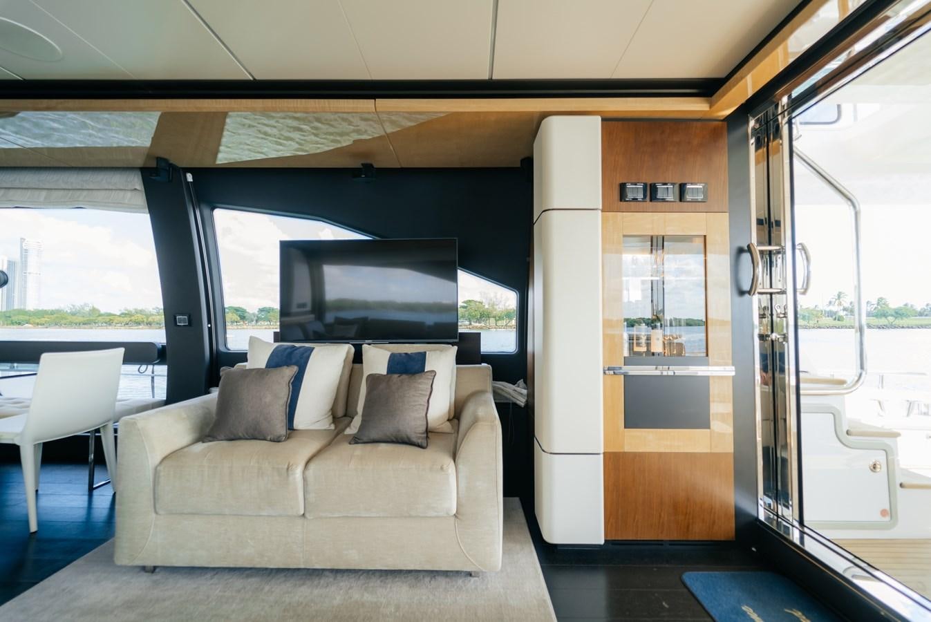 a room with a couch and a television aboard PENJA Yacht for Sale