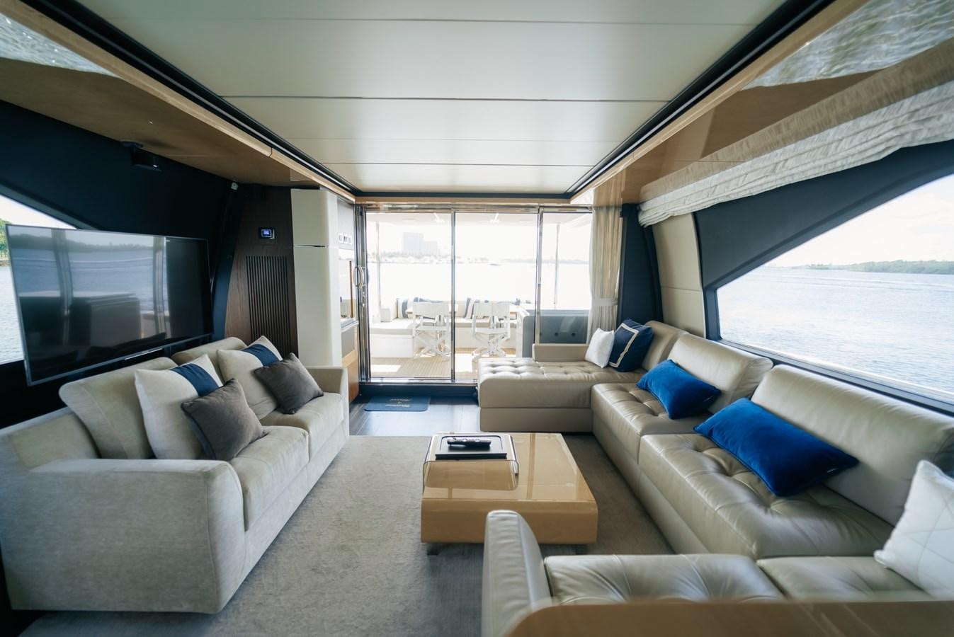 a living room with a large window aboard PENJA Yacht for Sale