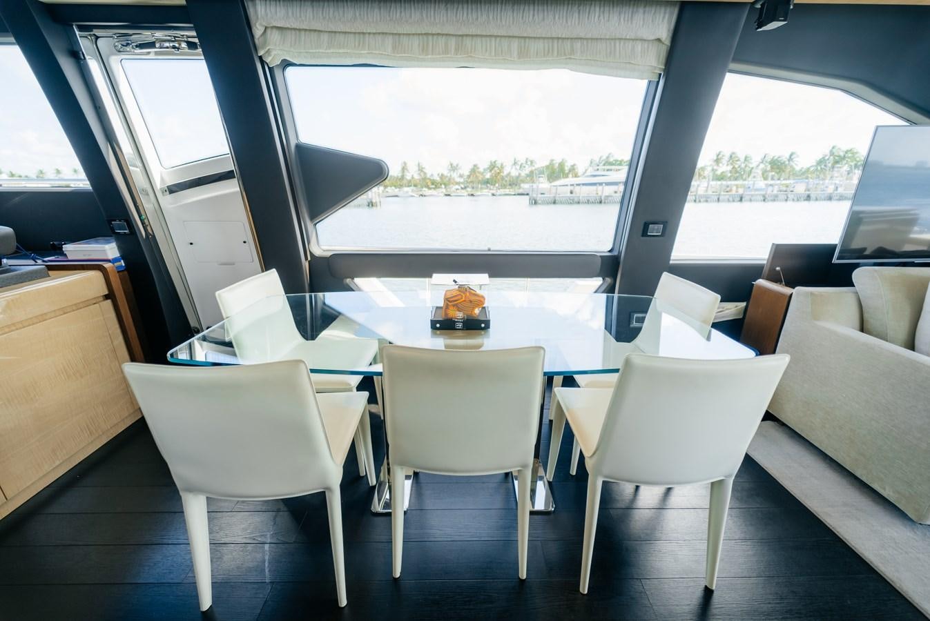 a room with a table chairs and a window aboard PENJA Yacht for Sale