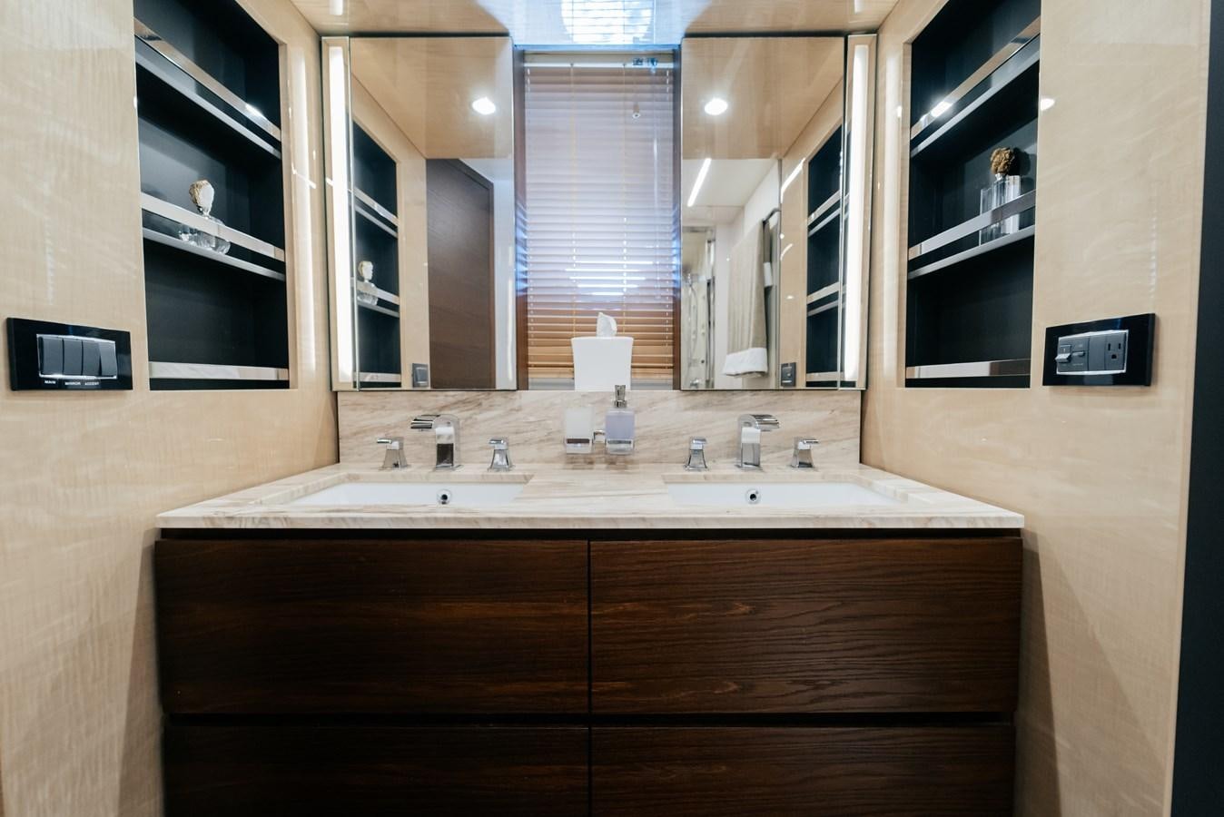 a bathroom with a countertop sink and cabinets aboard PENJA Yacht for Sale