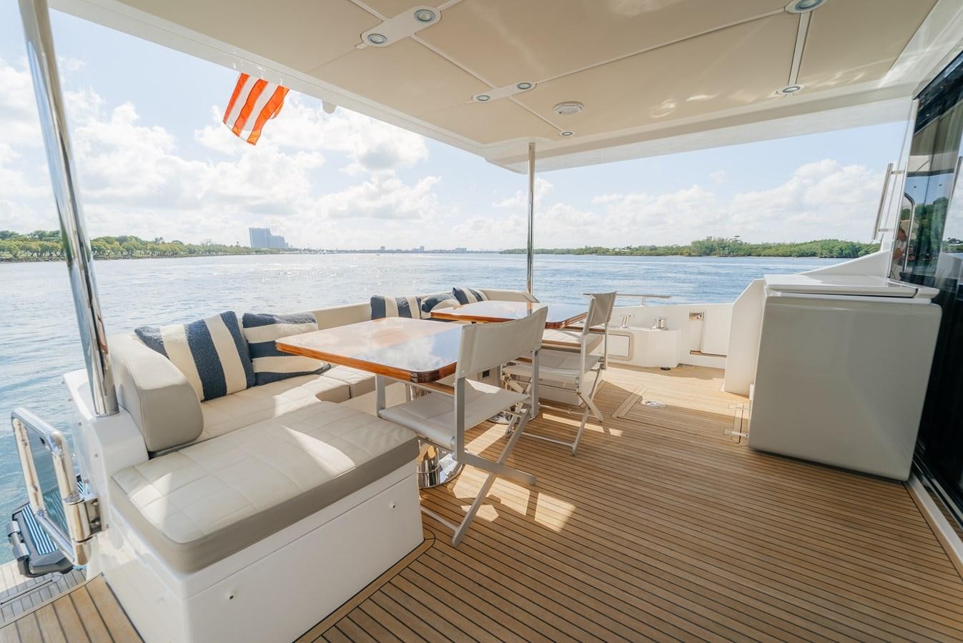 a room with a table and chairs aboard PENJA Yacht for Sale