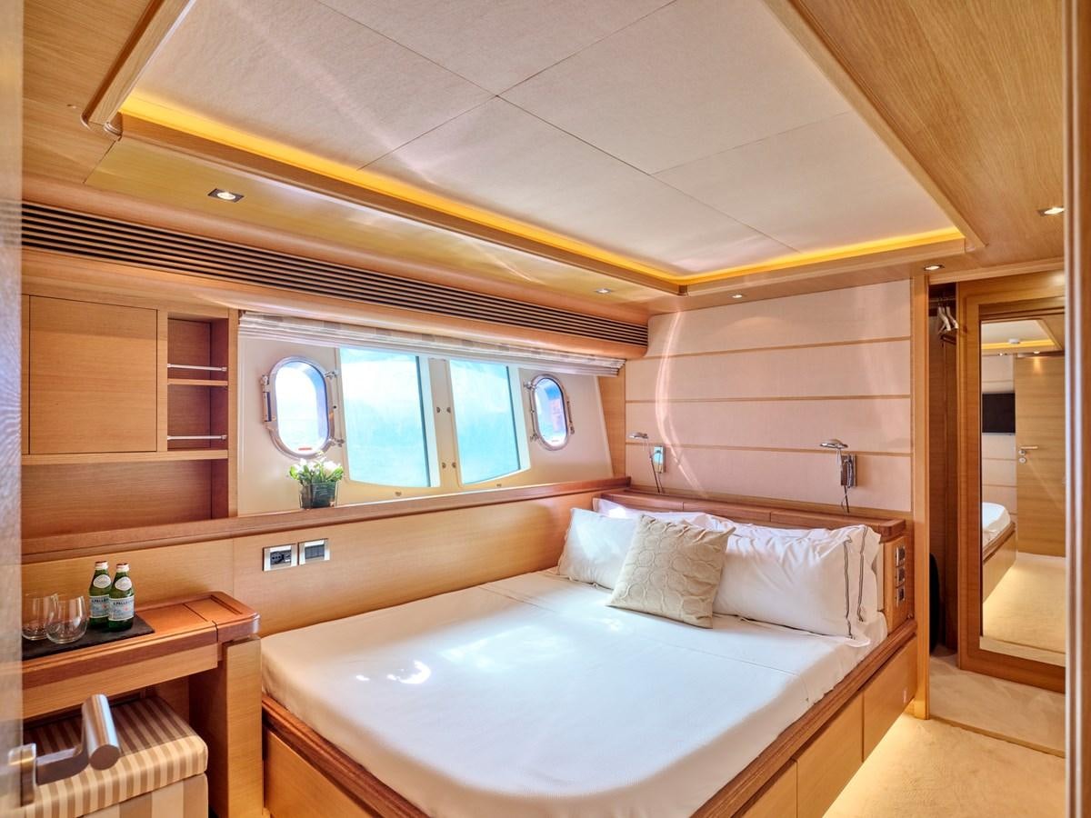 a bedroom with a bed aboard SEVEN S Yacht for Sale
