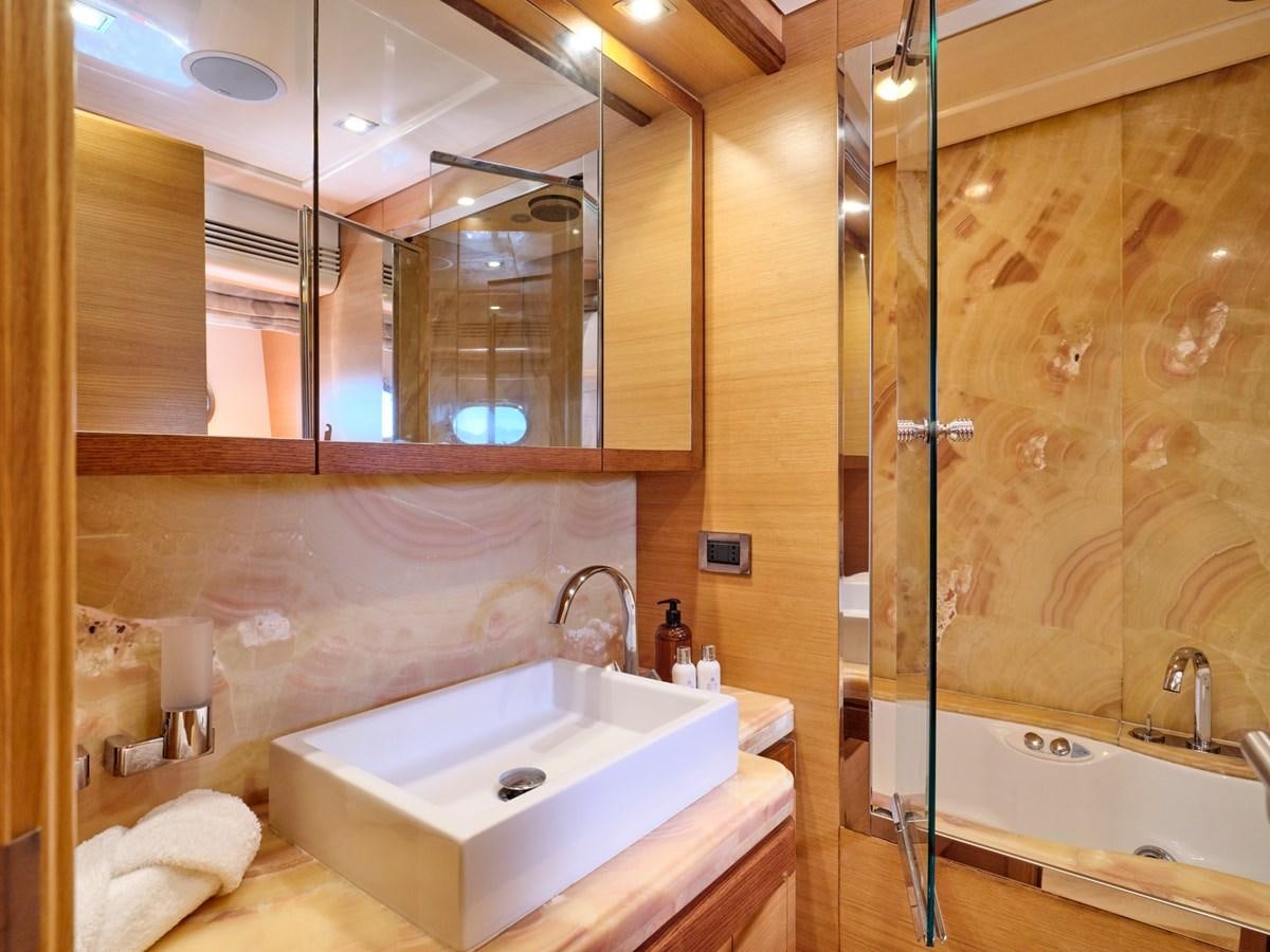 a bathroom with a glass shower aboard SEVEN S Yacht for Sale