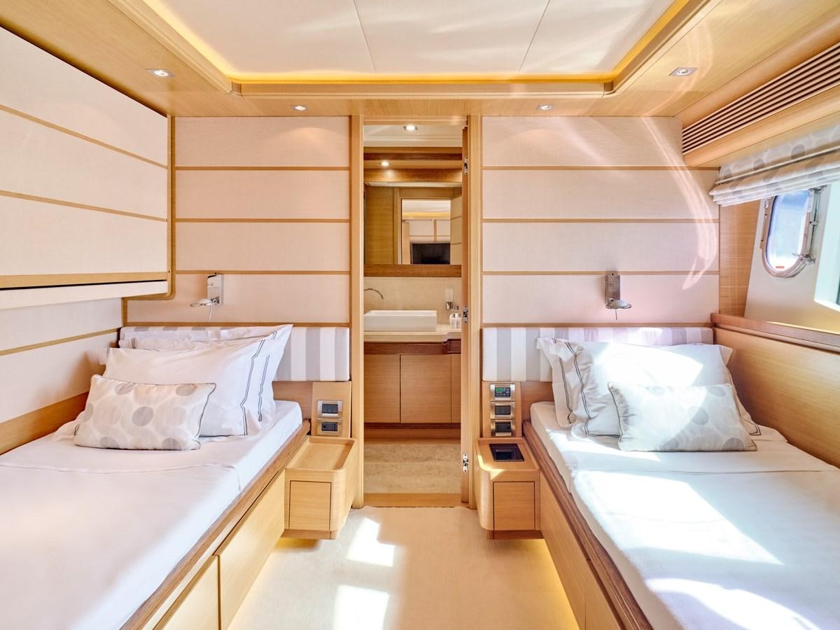 a room with two beds aboard SEVEN S Yacht for Sale