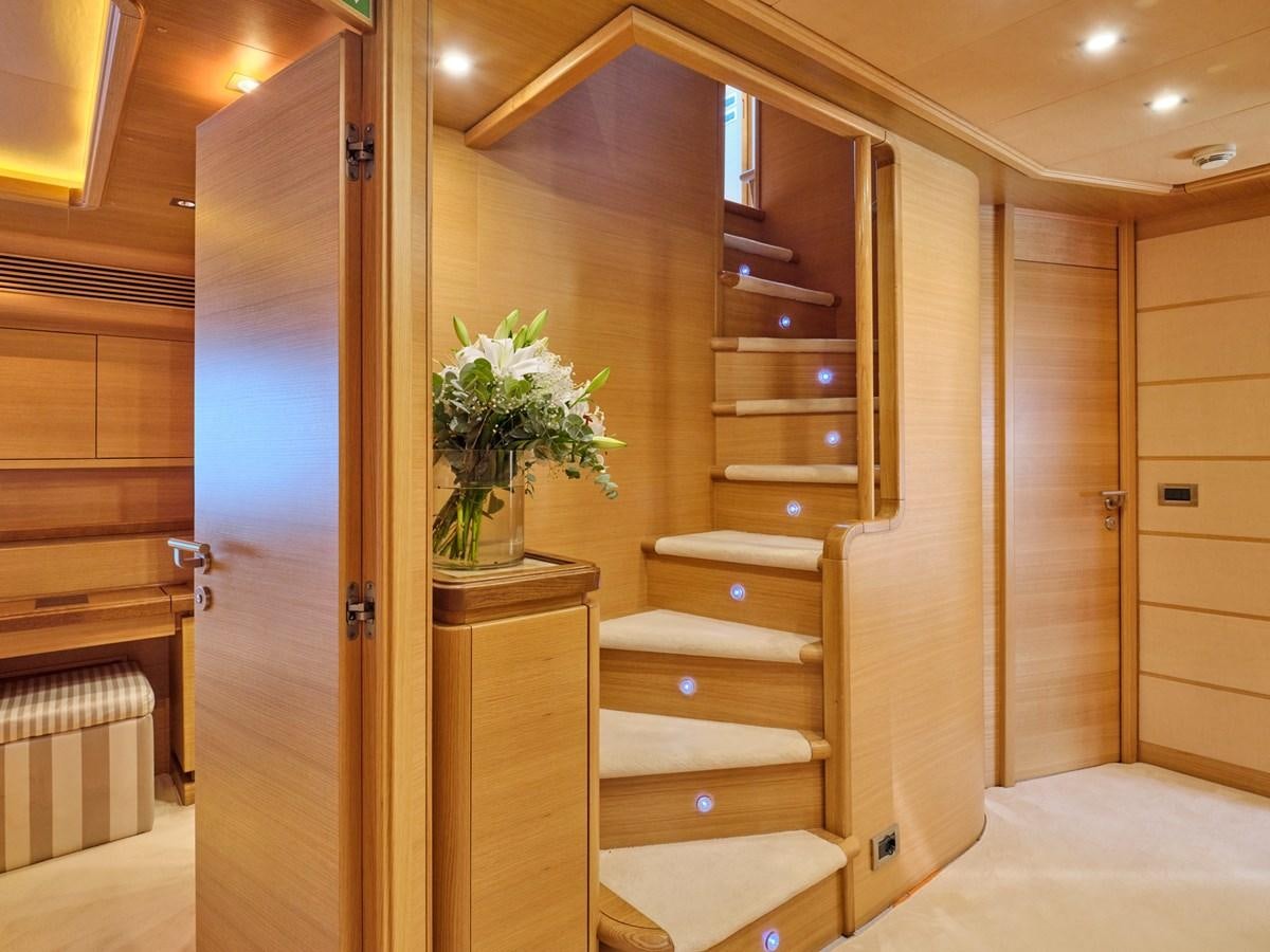 a room with a wood cabinet and a plant in a pot on the door aboard SEVEN S Yacht for Sale