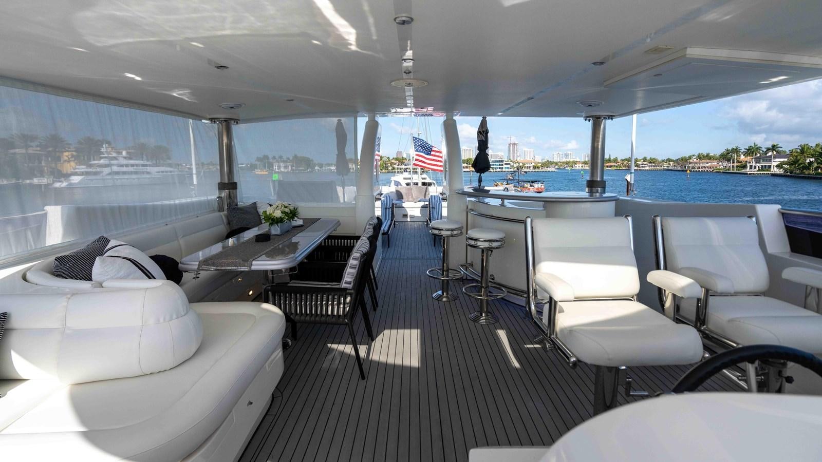a boat with a table and chairs aboard NEVER SETTLE Yacht for Sale