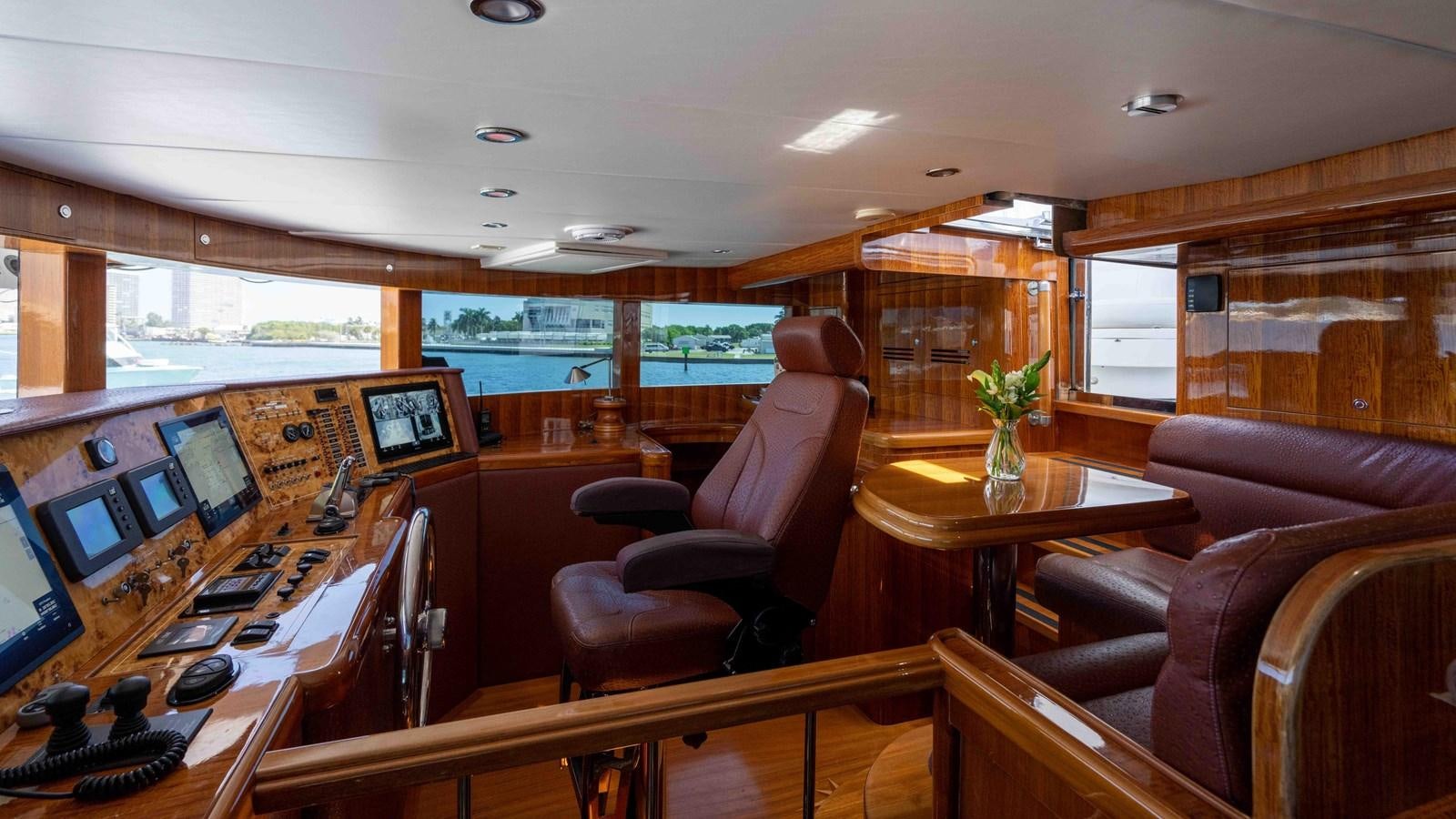 a room with a table and chairs aboard NEVER SETTLE Yacht for Sale