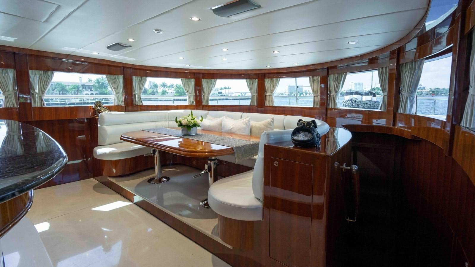 a room with a table and chairs aboard NEVER SETTLE Yacht for Sale