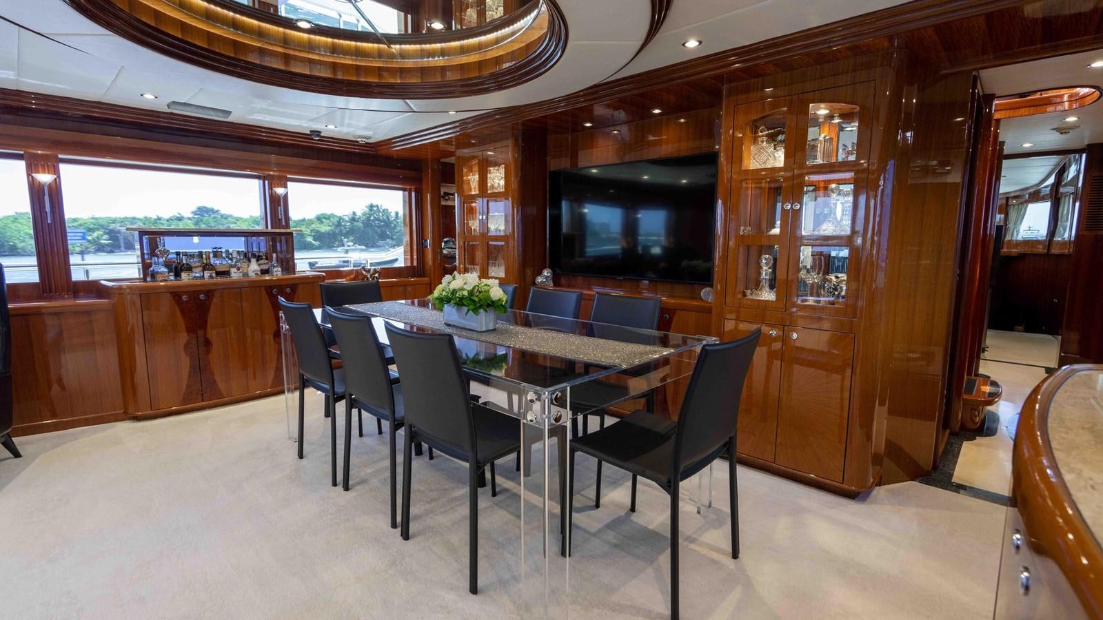 a room with a table and chairs aboard NEVER SETTLE Yacht for Sale