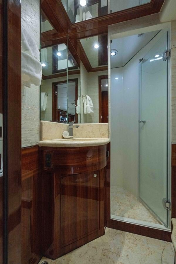 a bathroom with a sink and a mirror aboard NEVER SETTLE Yacht for Sale