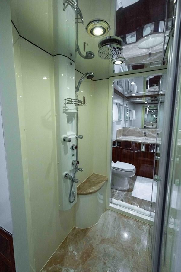 a bathroom with a glass shower aboard NEVER SETTLE Yacht for Sale