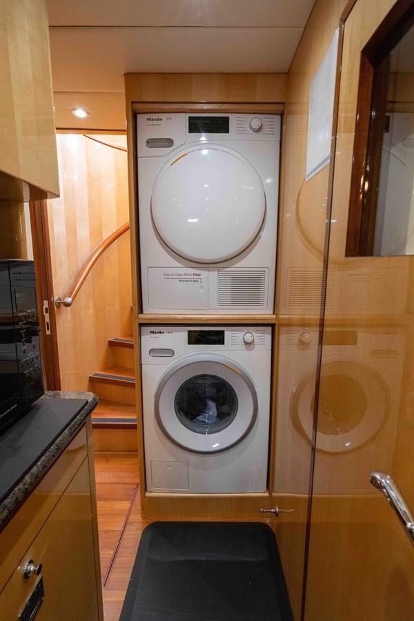 a washing machine in a room aboard NEVER SETTLE Yacht for Sale