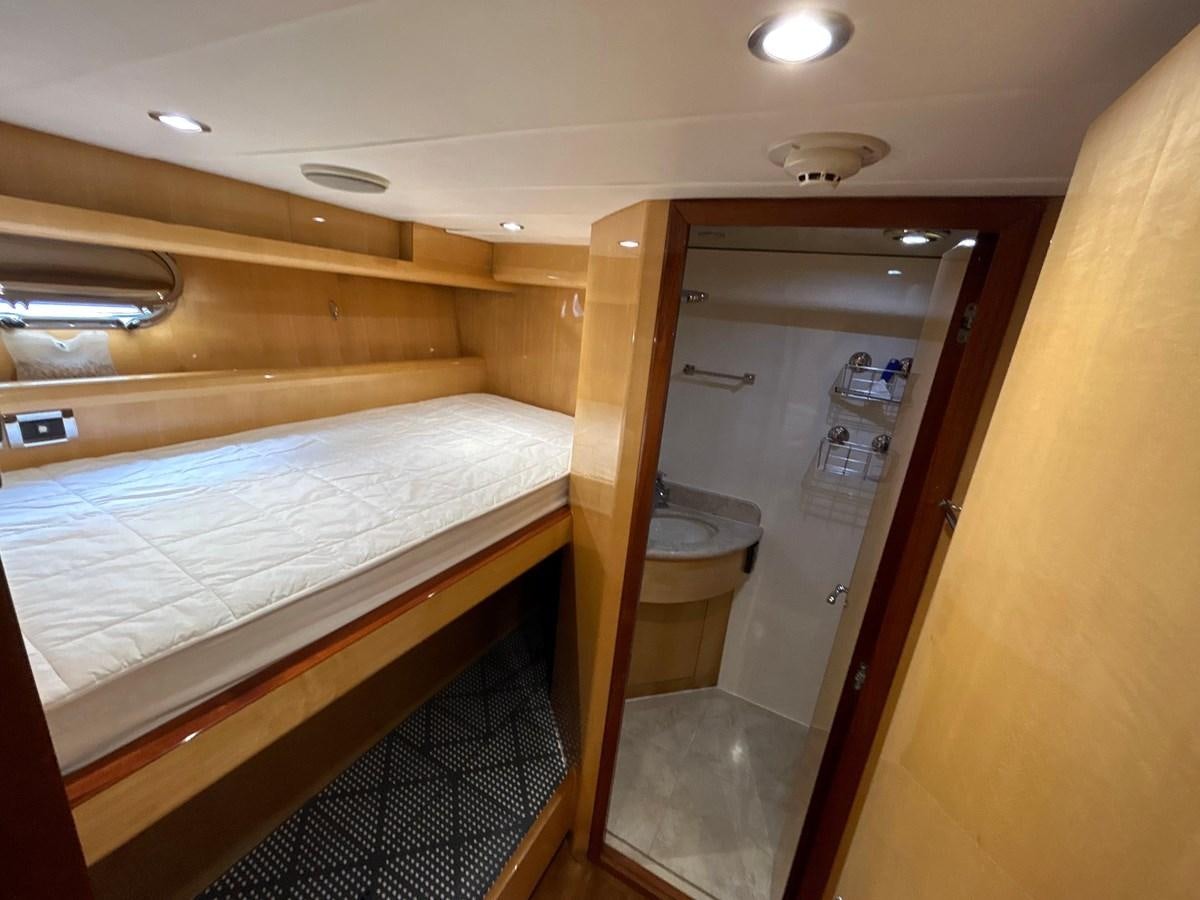 a bathroom with a couple of beds aboard NEVER SETTLE Yacht for Sale
