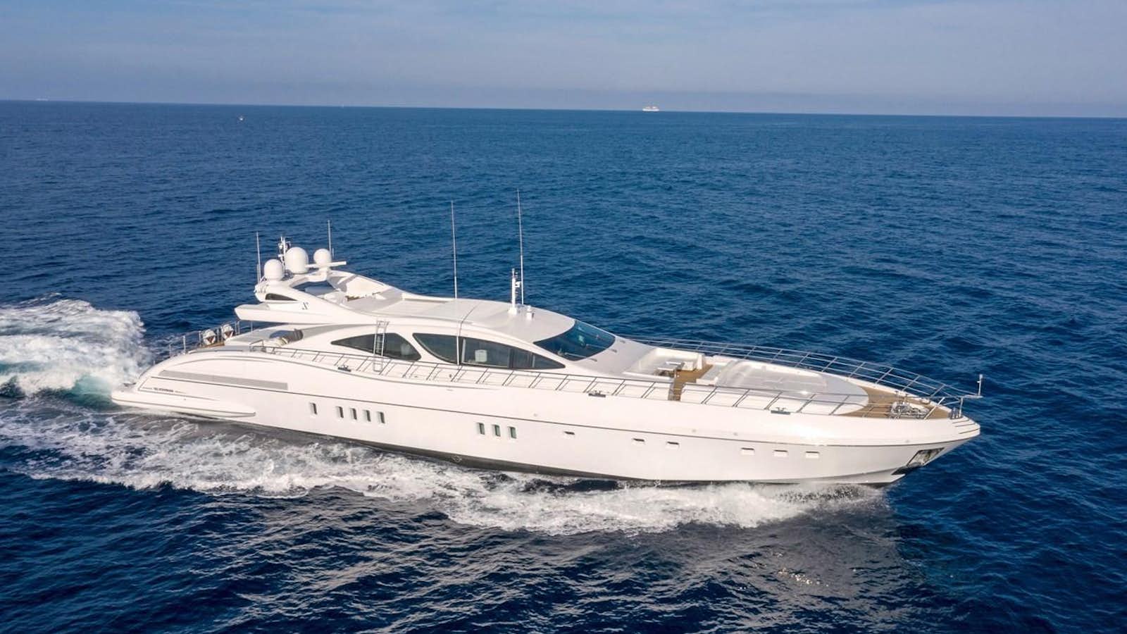 a white yacht in the ocean aboard CRAZY Yacht for Sale