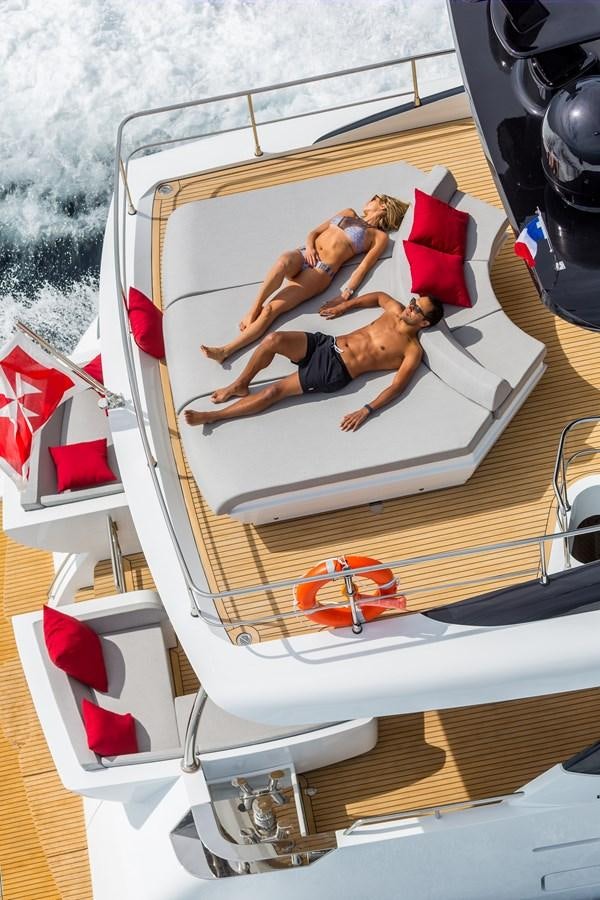 a man and woman on a boat aboard 2025 CANADOS 808’ MAXIMUS Yacht for Sale