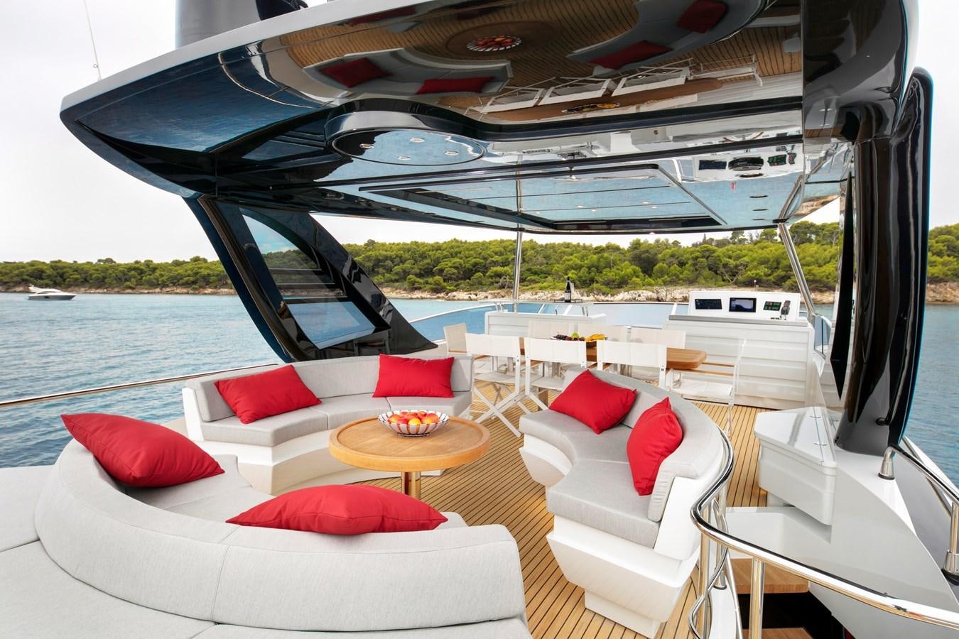 a boat with pillows and a table on a boat aboard 2025 CANADOS 808’ MAXIMUS Yacht for Sale