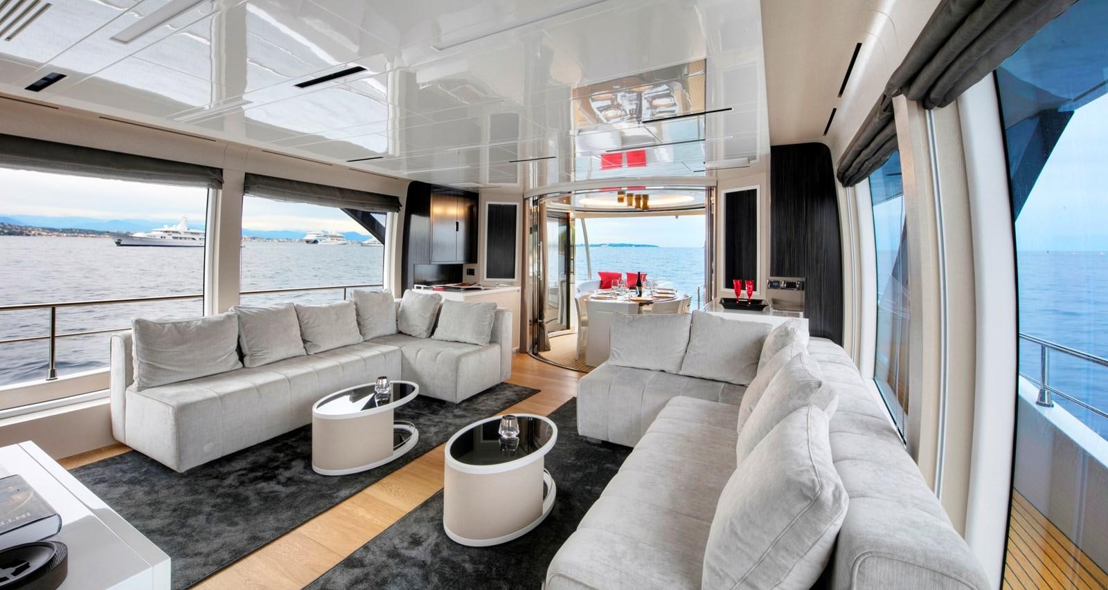 a living room with a large window aboard 2025 CANADOS 808’ MAXIMUS Yacht for Sale