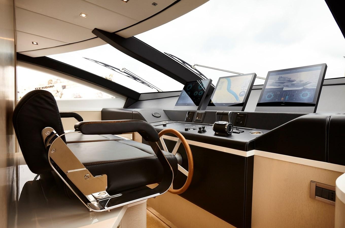 a black leather chair in front of a computer monitor and a black leather seat aboard 2025 CANADOS 808’ MAXIMUS Yacht for Sale