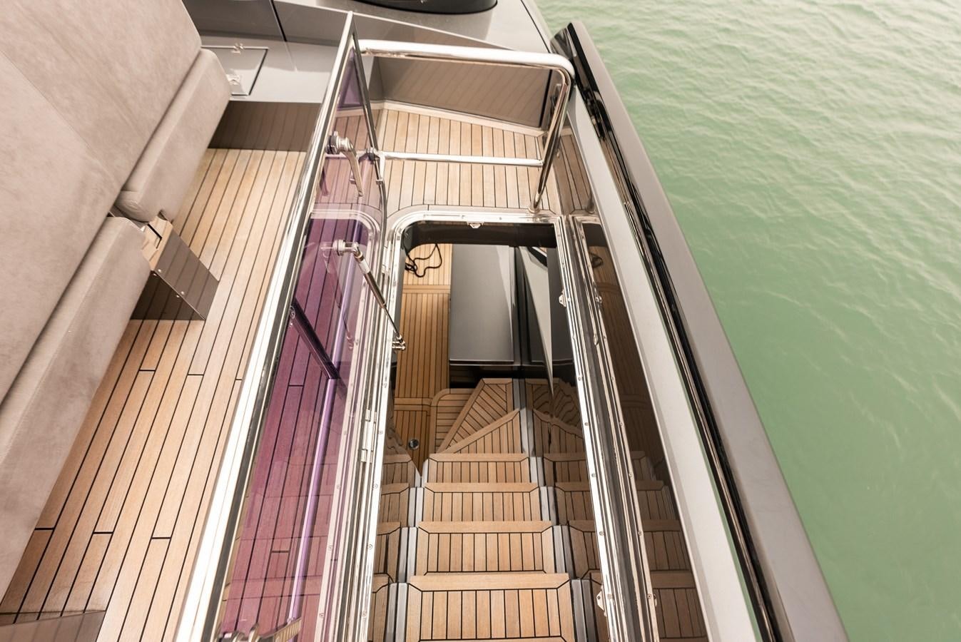 a staircase with a railing and a pool of water aboard MORNINGSTAR Yacht for Sale