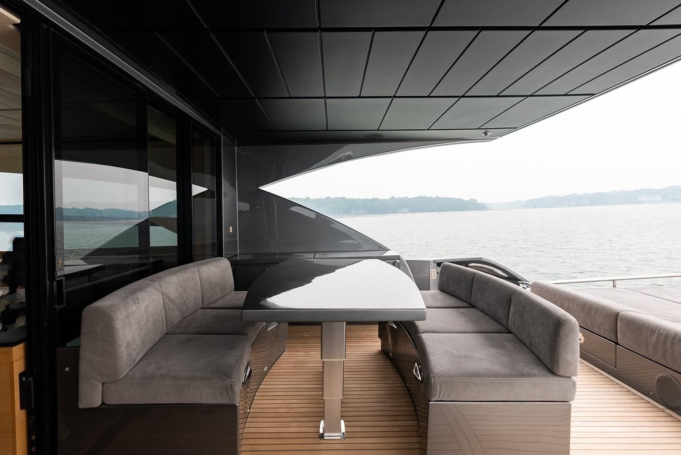 a room with a couch and a table aboard MORNINGSTAR Yacht for Sale
