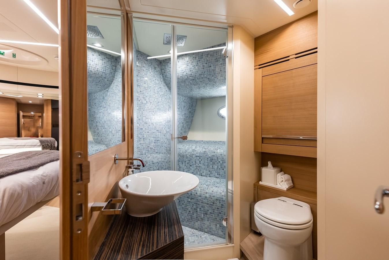 a bathroom with a glass shower aboard MORNINGSTAR Yacht for Sale