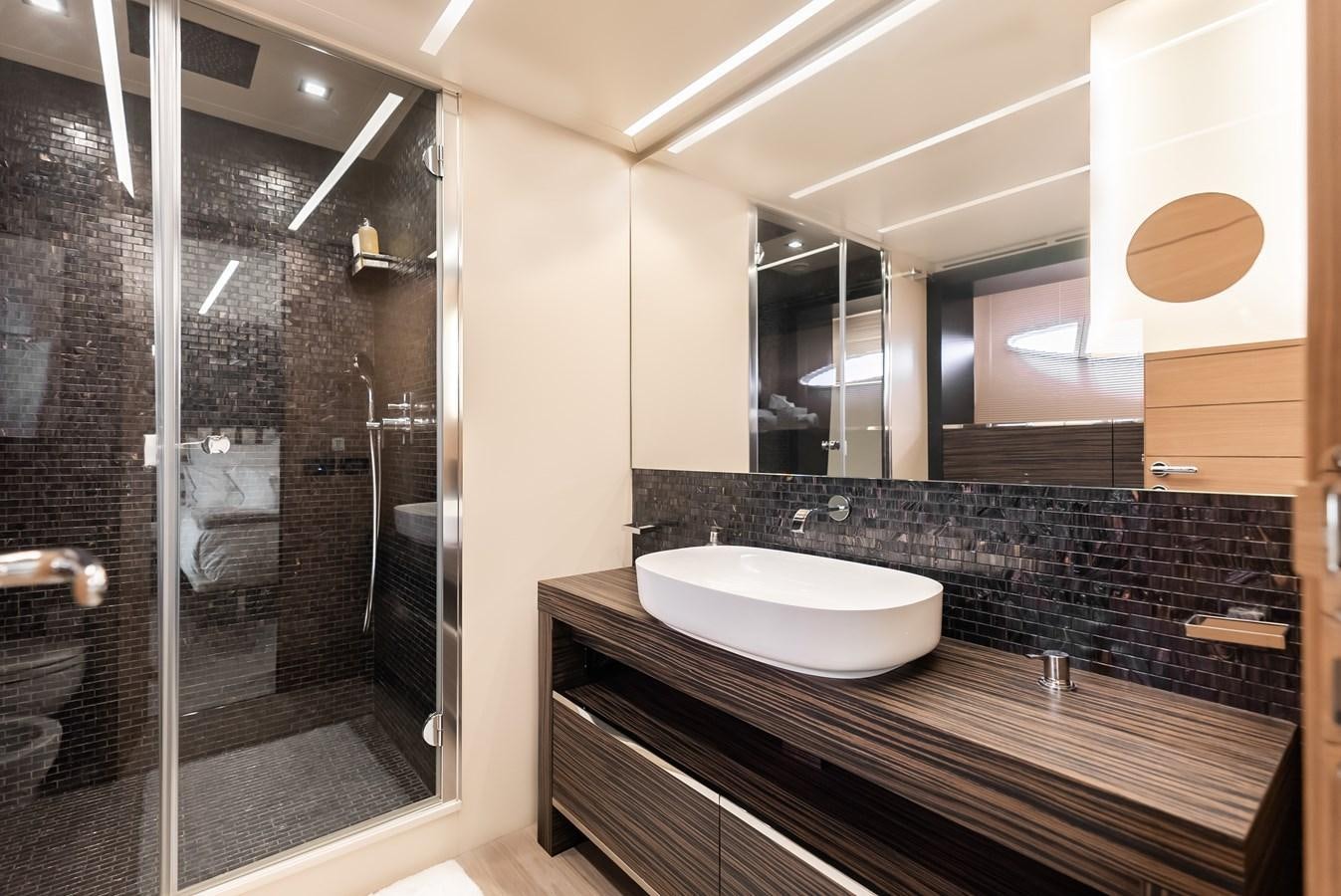 a bathroom with a large mirror aboard MORNINGSTAR Yacht for Sale