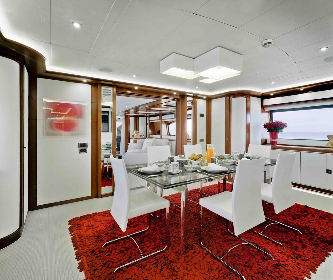 a large room with a table and chairs aboard BUNKER Yacht for Sale