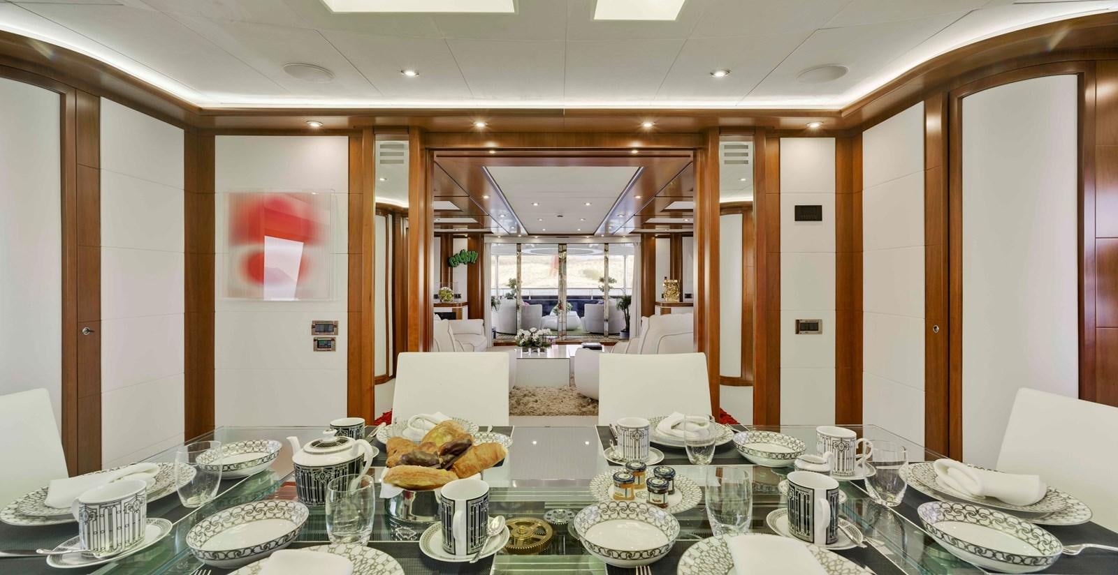 a large dining room with a table set for a meal aboard BUNKER Yacht for Sale