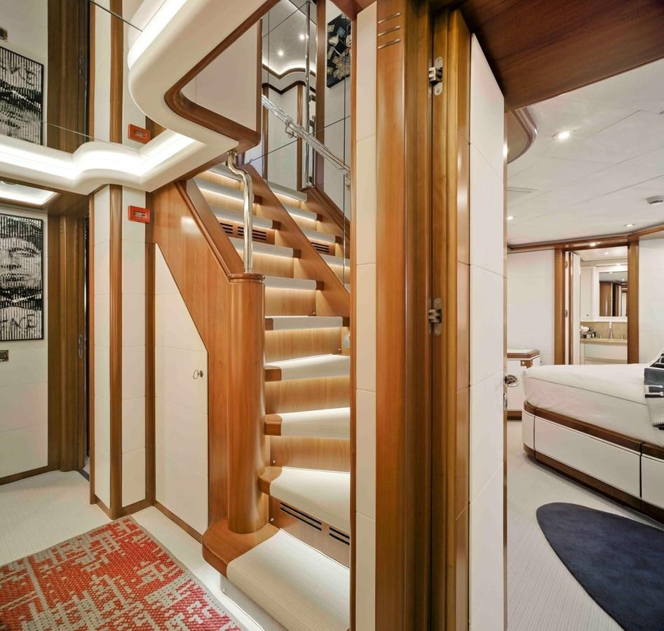 a wooden staircase in a room aboard BUNKER Yacht for Sale