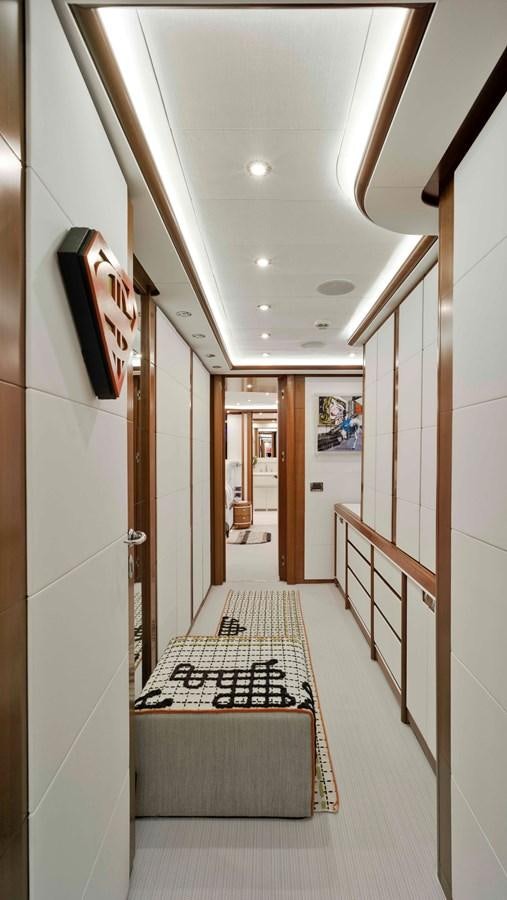 a hallway with a rug aboard BUNKER Yacht for Sale