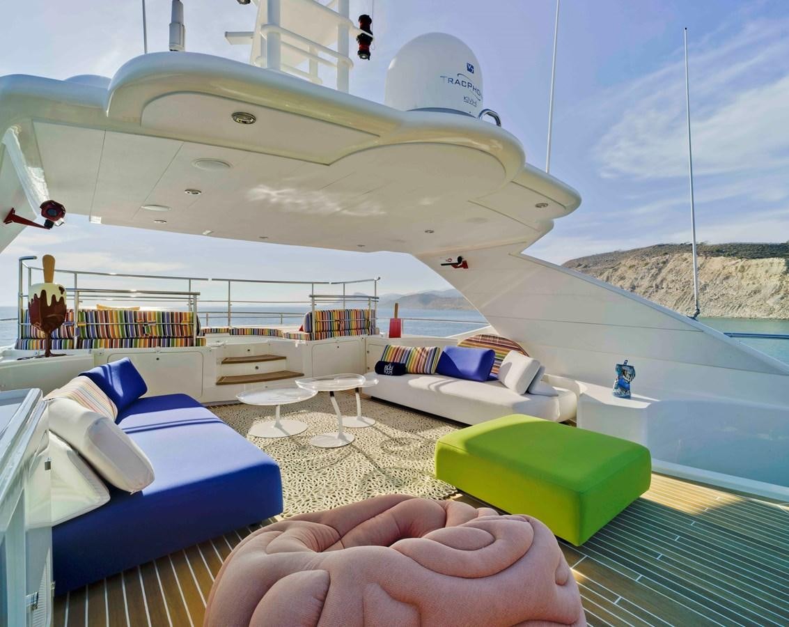 a large white tent with a couple of beds and a picnic table aboard BUNKER Yacht for Sale