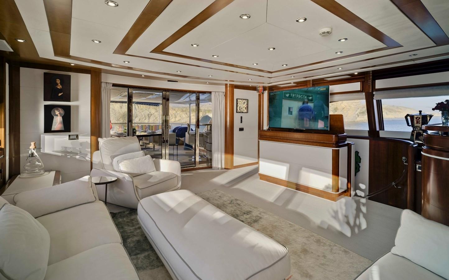 a living room with a large window aboard BUNKER Yacht for Sale
