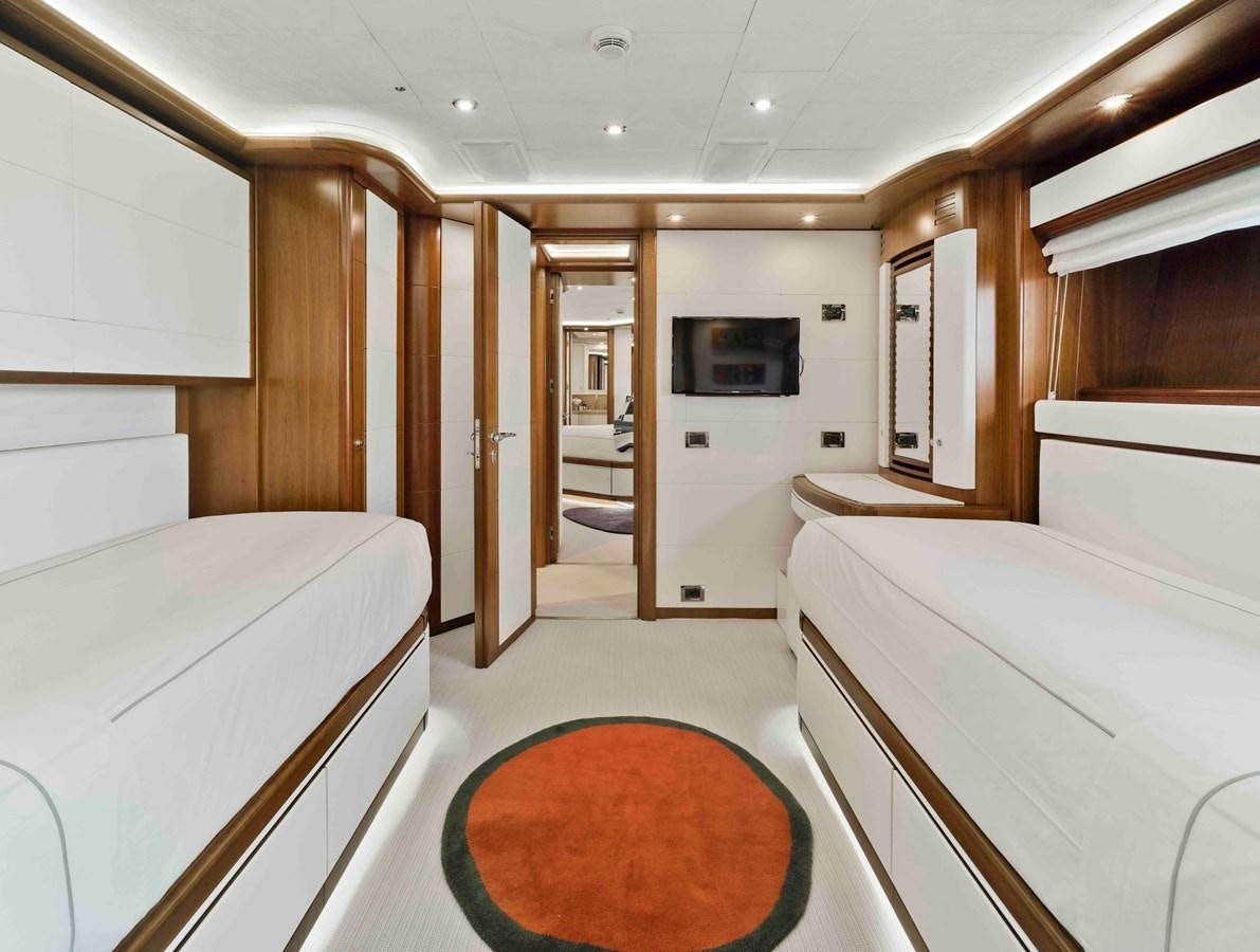 a room with a bed and a television aboard BUNKER Yacht for Sale