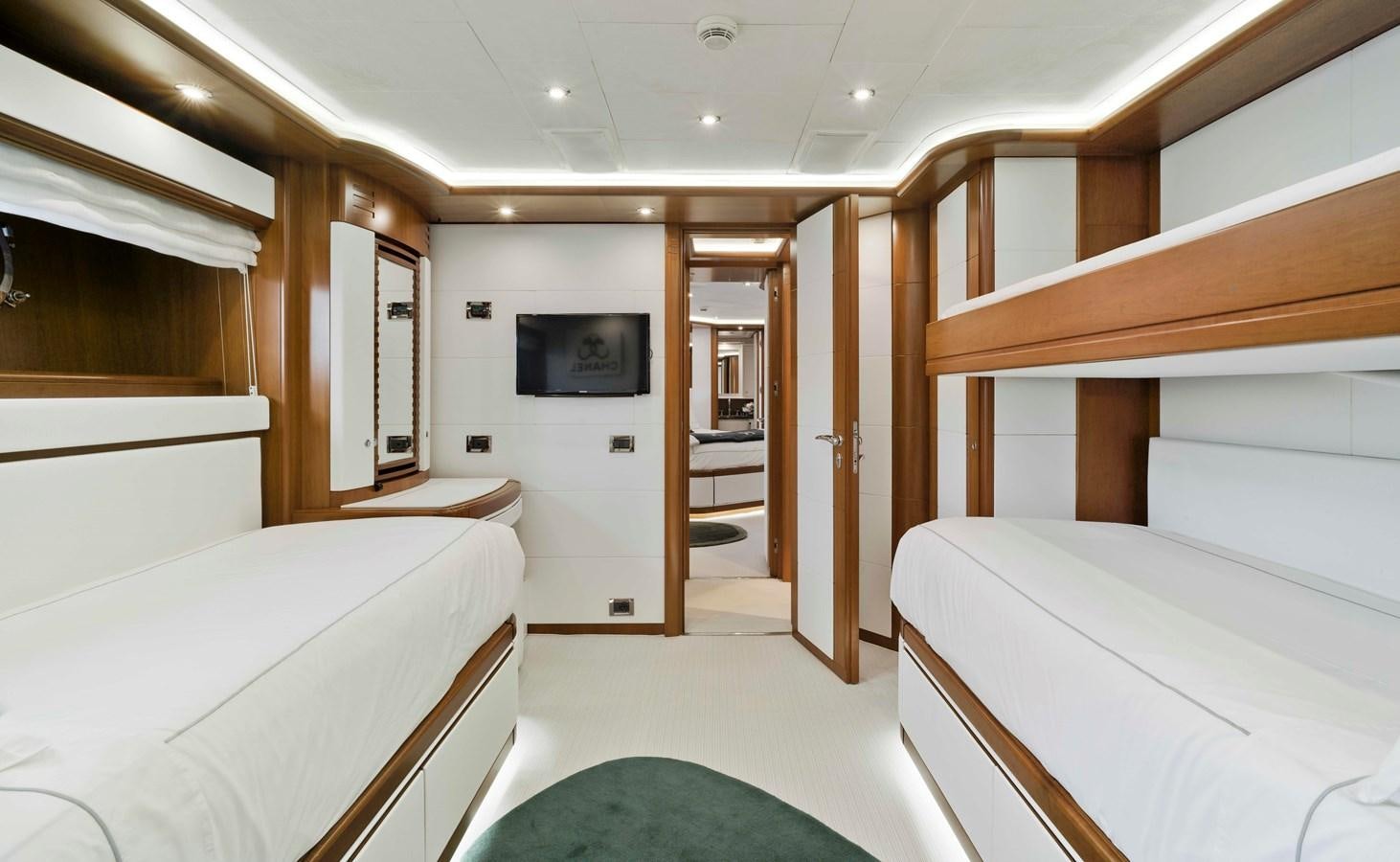a room with a bed and a television aboard BUNKER Yacht for Sale
