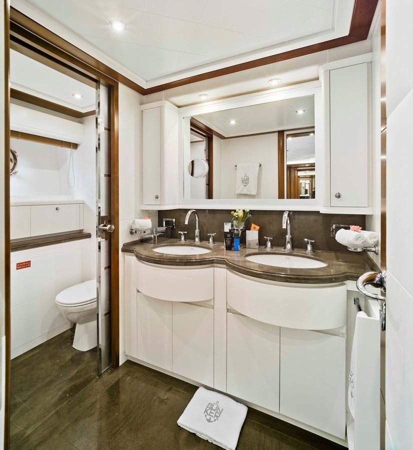 a bathroom with a sink and a toilet aboard BUNKER Yacht for Sale