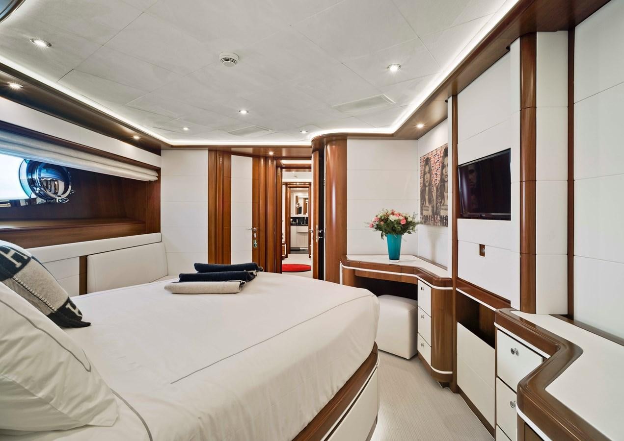 a room with a bed and a television aboard BUNKER Yacht for Sale