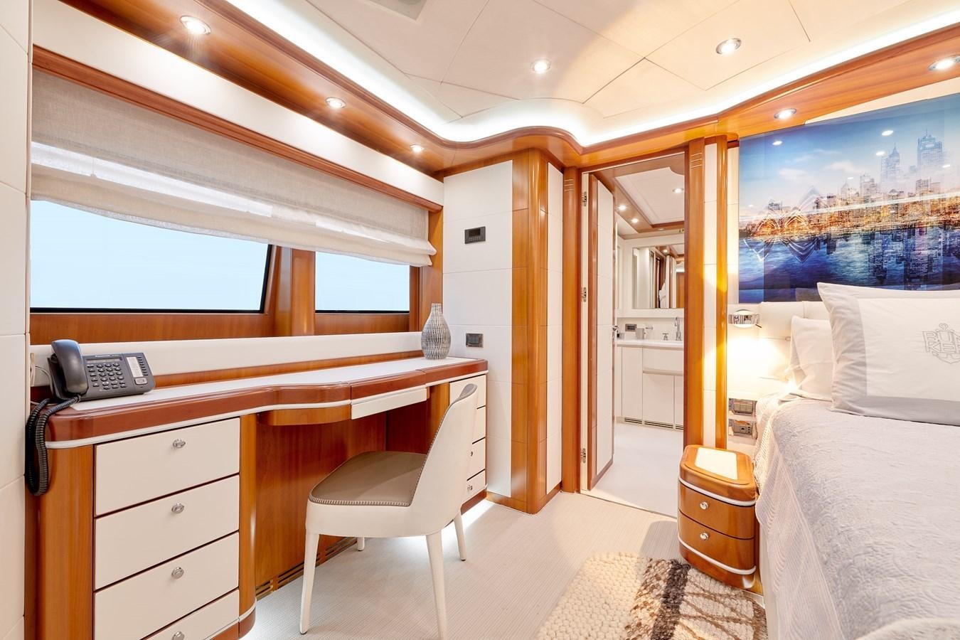 a room with a desk and a bed aboard BUNKER Yacht for Sale