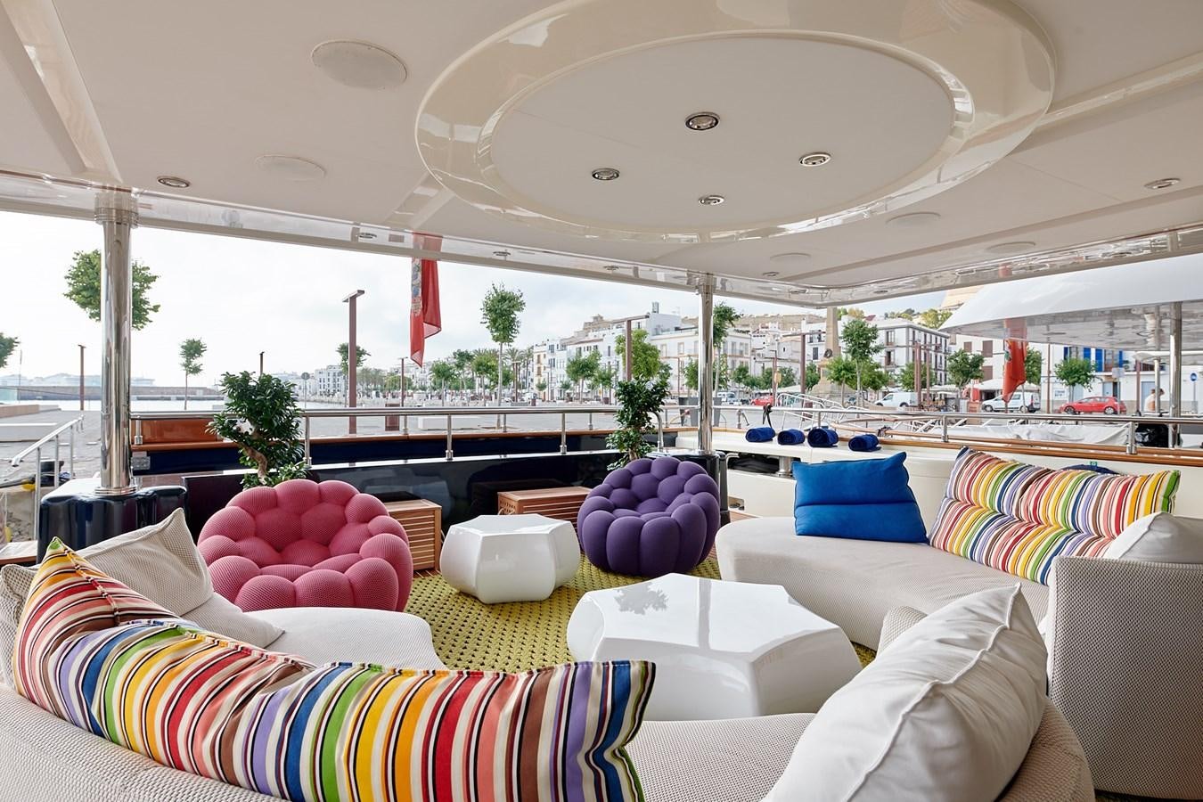 a large room with couches and a large tent aboard BUNKER Yacht for Sale